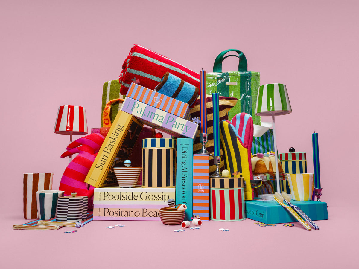 A collection of bright, stripe-covered products on a mauve background.