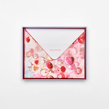 Piecework Cloud Nine Stationery Set: open lavender box of pink glassware notecards and envelopes under a vellum band