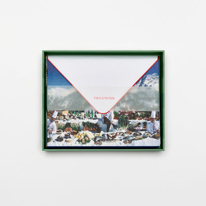 Piecework Culinary Heights Stationery Set: open green-striped box of alpine feast notecards and envelopes under a vellum band