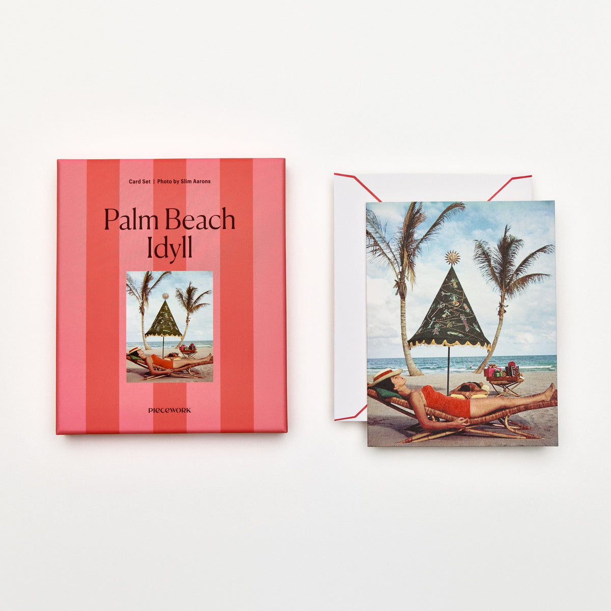 Piecework Palm Beach Idyll Stationery Set: coral-striped box and Slim Aarons card of a sunbather under palms, plus envelope