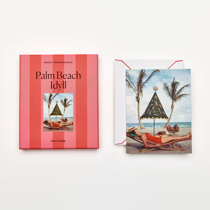 Piecework Palm Beach Idyll Stationery Set: coral-striped box and Slim Aarons card of a sunbather under palms, plus envelope
