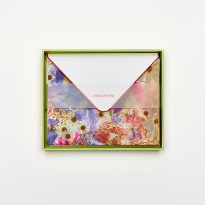 Piecework Petal Post Stationery Set: open lime green box of dewy floral notecards and envelopes under a vellum band