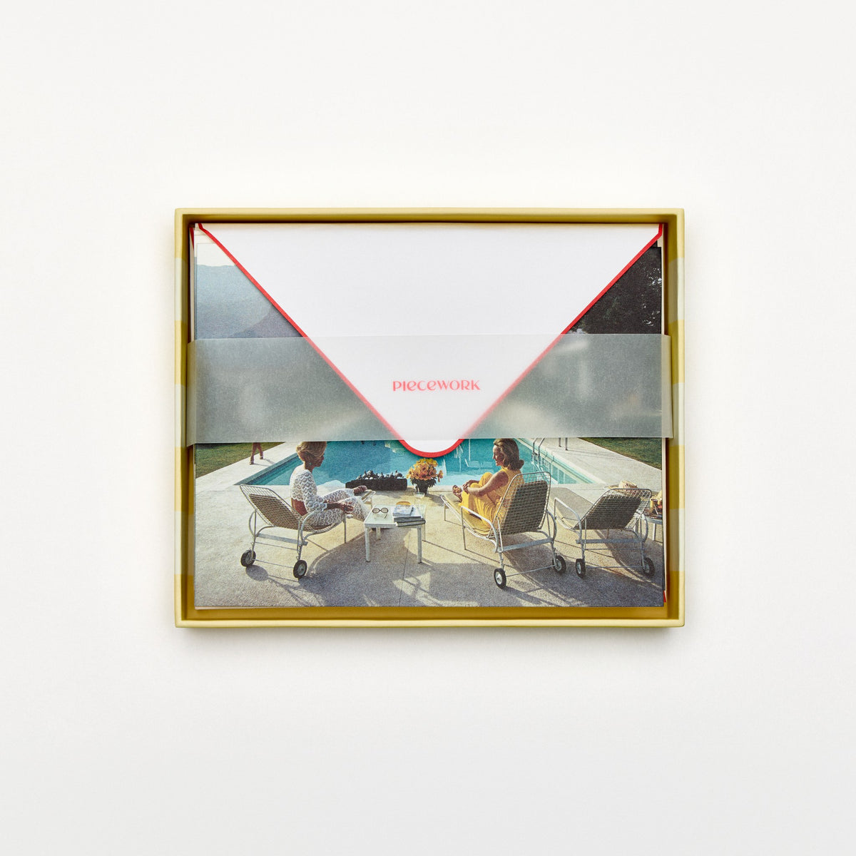 Piecework Poolside Gossip Stationery Set: open yellow-striped box of poolside notecards and envelopes under a vellum band
