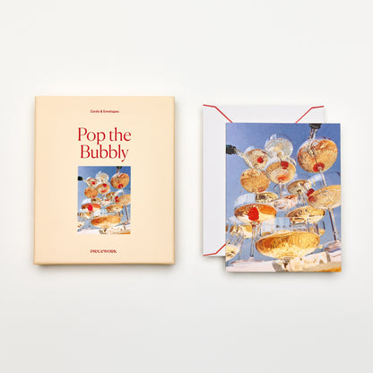 Piecework Pop the Bubbly Stationery Set: peach box and notecard of a champagne coupe tower, plus envelope