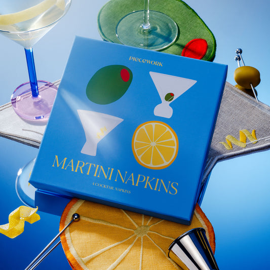Piecework Martini Napkins boxed gift set with martini-themed linen cocktail napkins styled for entertaining with martinis and garnishes.