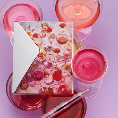 Piecework Cloud Nine Stationery Set: glassware notecard and envelope on lilac surrounded by pink wine glasses