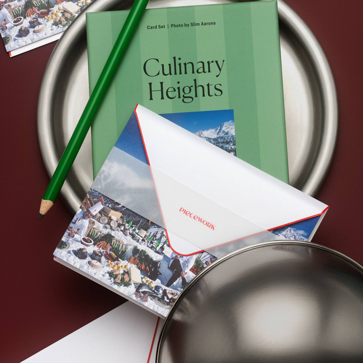 Piecework Culinary Heights Stationery Set: green-striped box and notecards on a silver tray beside a cloche, burgundy
