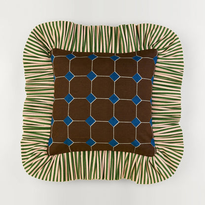 Jewel Stripe Ruffle Pillow front: brown tile print with blue jewels and a green striped ruffle