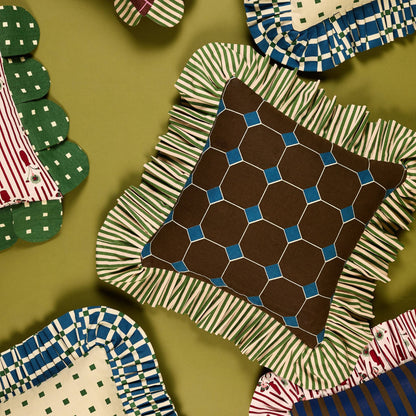 Jewel Stripe Ruffle Pillow from above, surrounded by other Piecework pillows