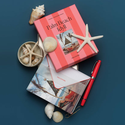 Piecework Palm Beach Idyll Stationery Set: coral-striped box and Slim Aarons notecard with shells, starfish and a red pen