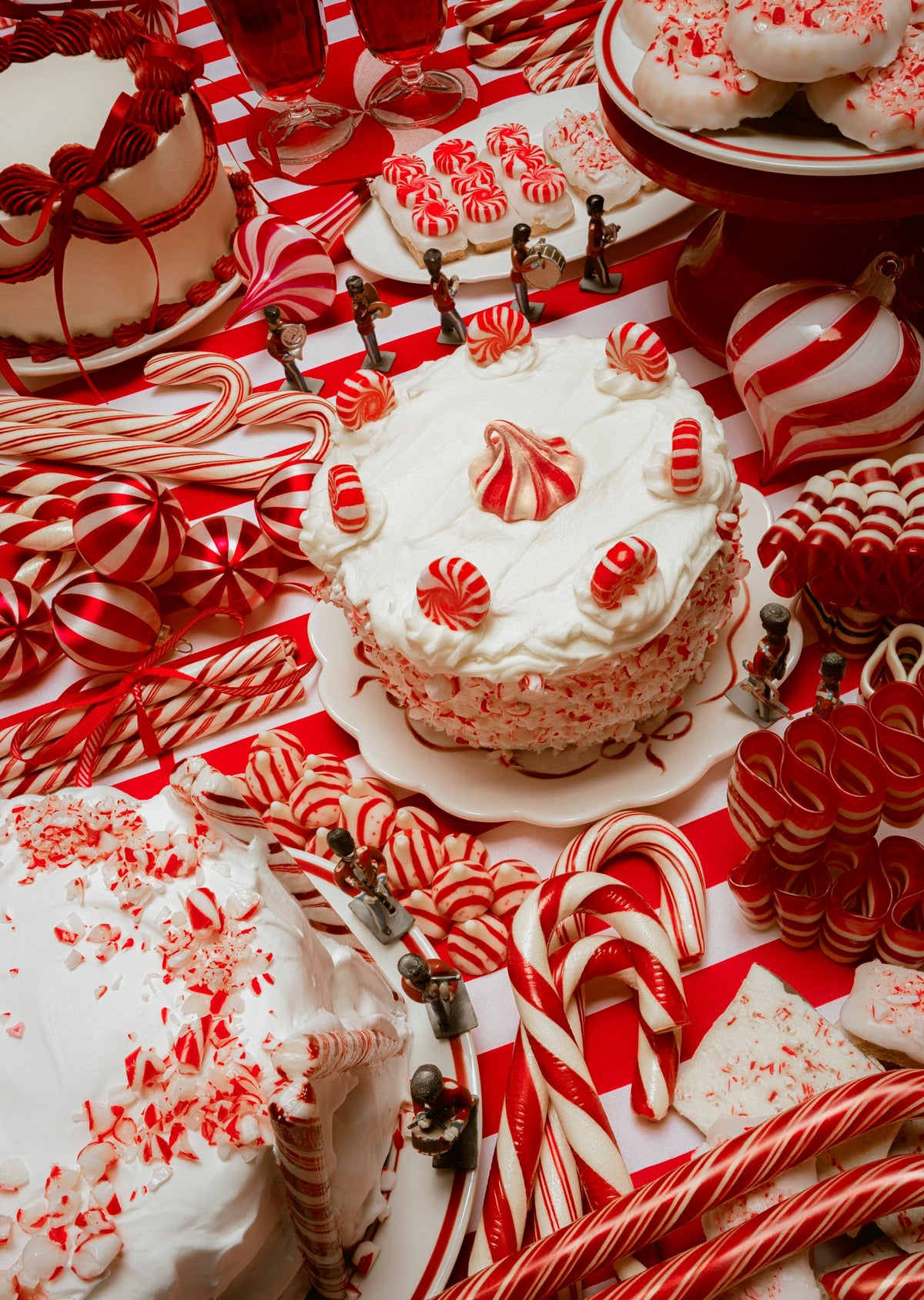 Peppermint Parade puzzle art of layer cakes, candy canes, peppermint drops and toy soldiers on a red-and-white table