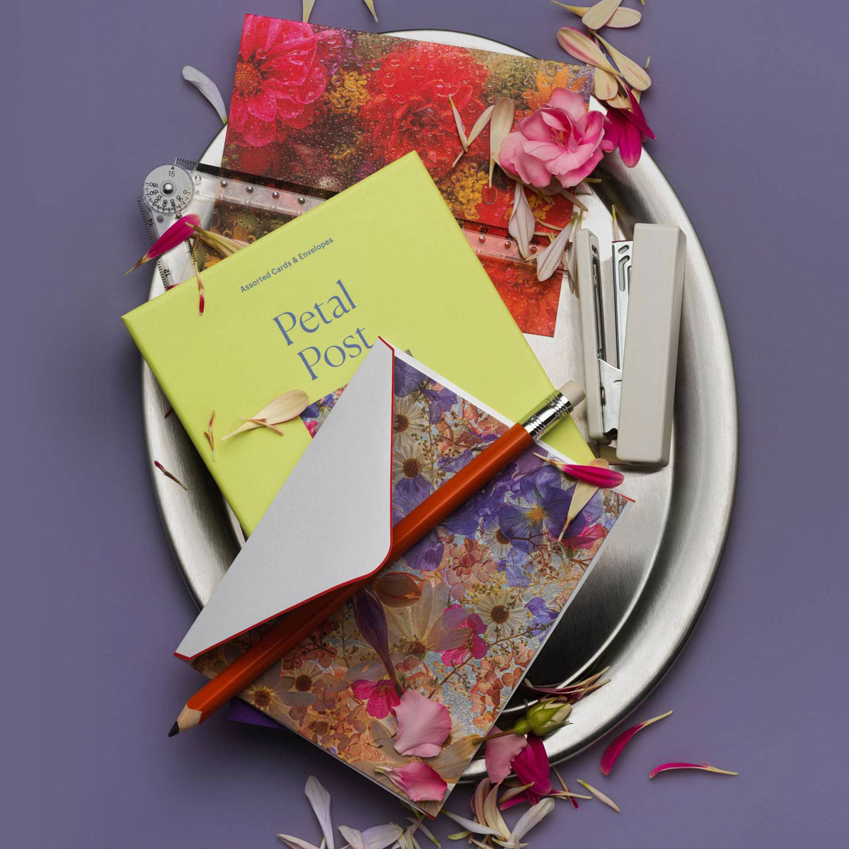 Piecework Petal Post Stationery Set: lime box and floral notecards on a silver platter with petals and a pencil