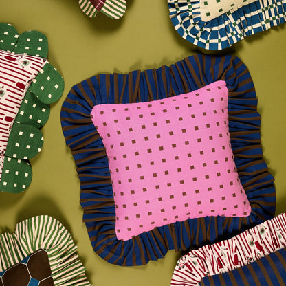 Pink Checks Ruffle Pillow from above, surrounded by other Piecework pillows