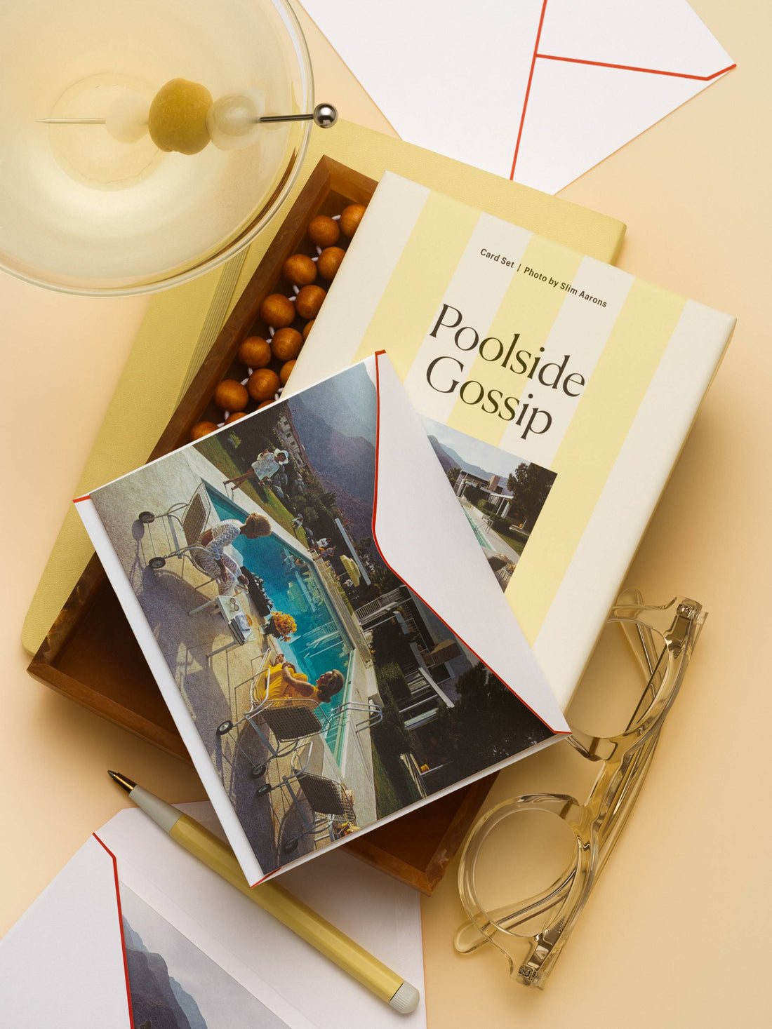 Piecework Poolside Gossip boxed notecard set with a Slim Aarons pool scene card, martini and glasses on butter yellow