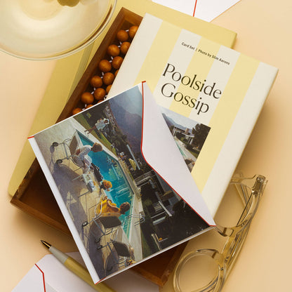 Piecework Poolside Gossip Stationery Set: yellow-striped box and Slim Aarons notecard in a wood tray beside a martini