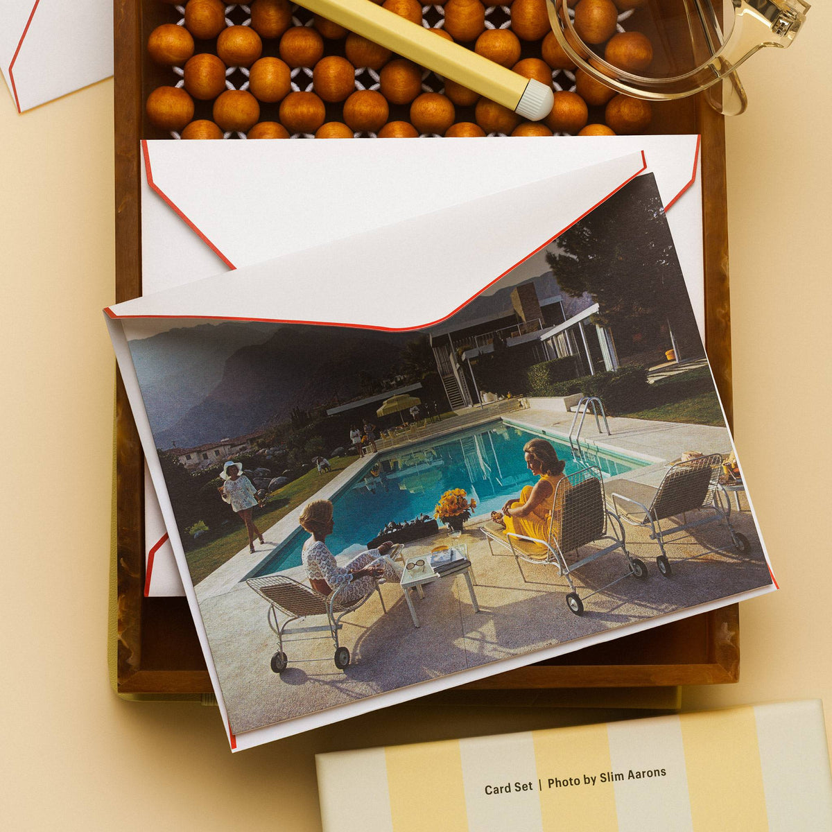 Piecework Poolside Gossip Stationery Set: Slim Aarons poolside notecard and envelope with reading glasses and pen on cream