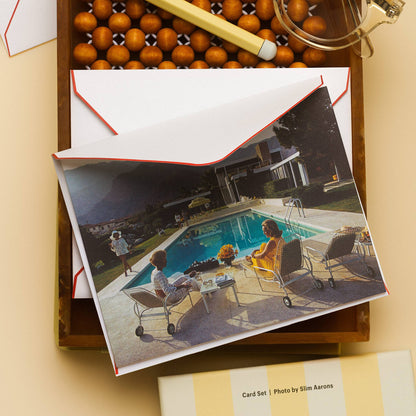Piecework Poolside Gossip Stationery Set: Slim Aarons poolside notecard and envelope with reading glasses and pen on cream