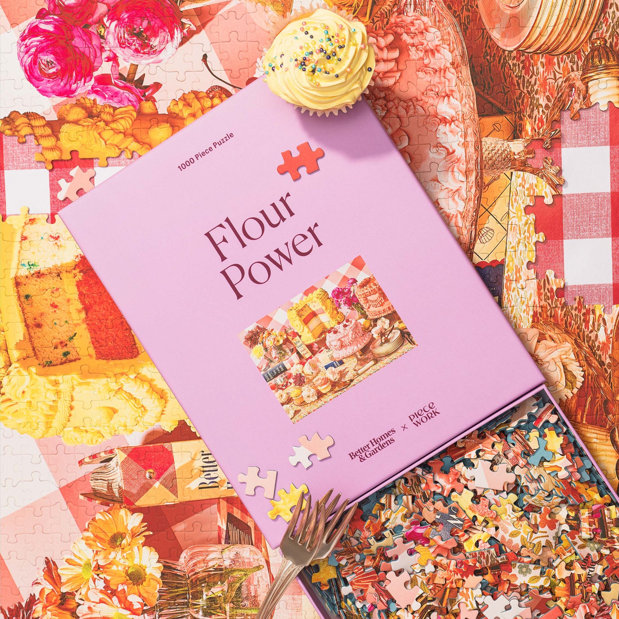Puzzle collaboration between Better Homes and Gardens and Piecework titled 'Flour Power' with puzzle pieces scattered around on a colorful background.