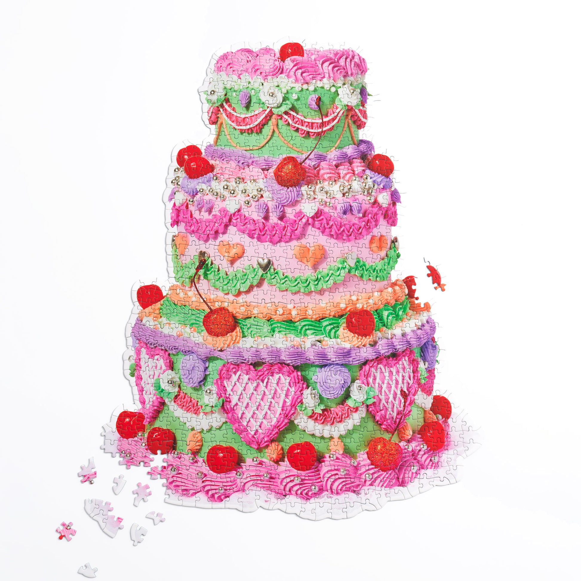 Cake Puzzle, a 750-piece cake-shaped puzzle, shown almost completely assembled on a white seamless background.