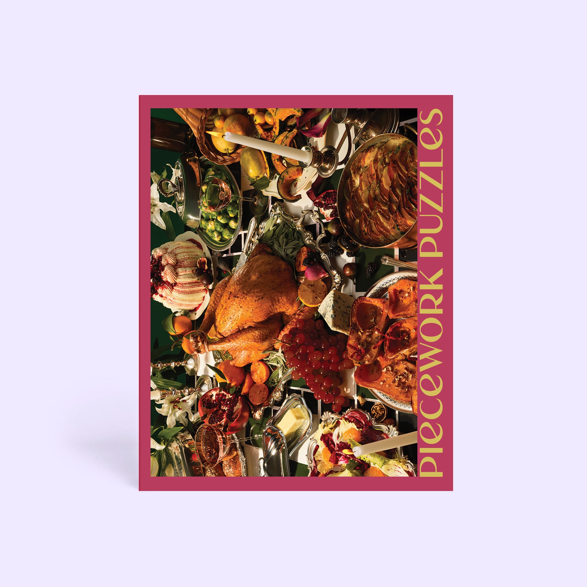 Jigsaw puzzle box with a colorful holiday feast image and 'Piecework Puzzles' text on a light purple background.