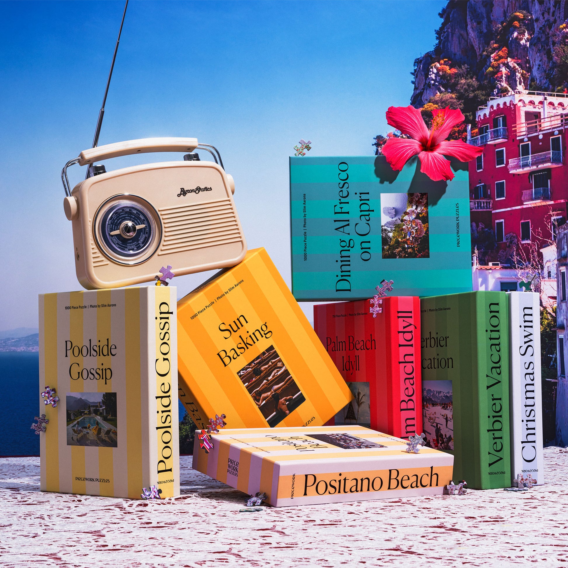 Vintage radio and Slim Aarons puzzles collection in a scenic background.