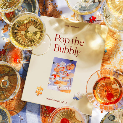 Pop the Bubbly puzzle box in a vibrant celebration scene with champagne glasses.