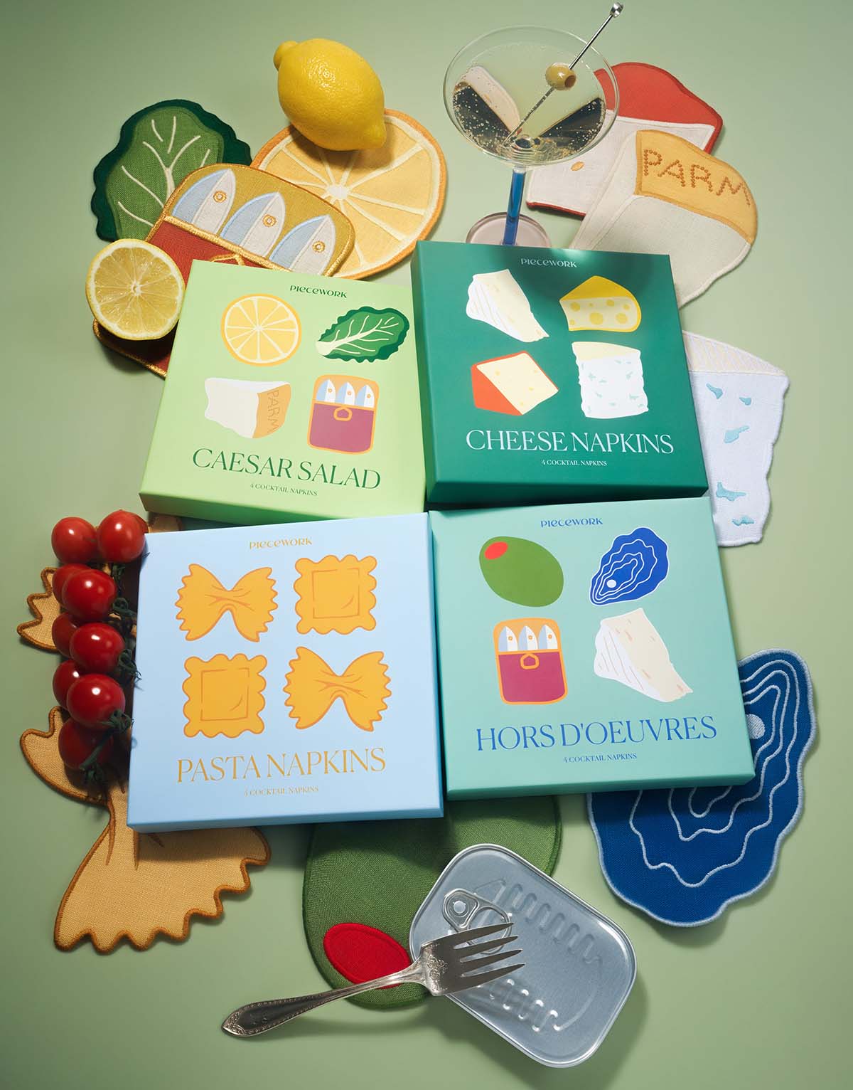 A group of savory cocktail napkin sets including Caesar Salad, Cheese, Pasta and Hors D'Oeuvres, alongside food props.