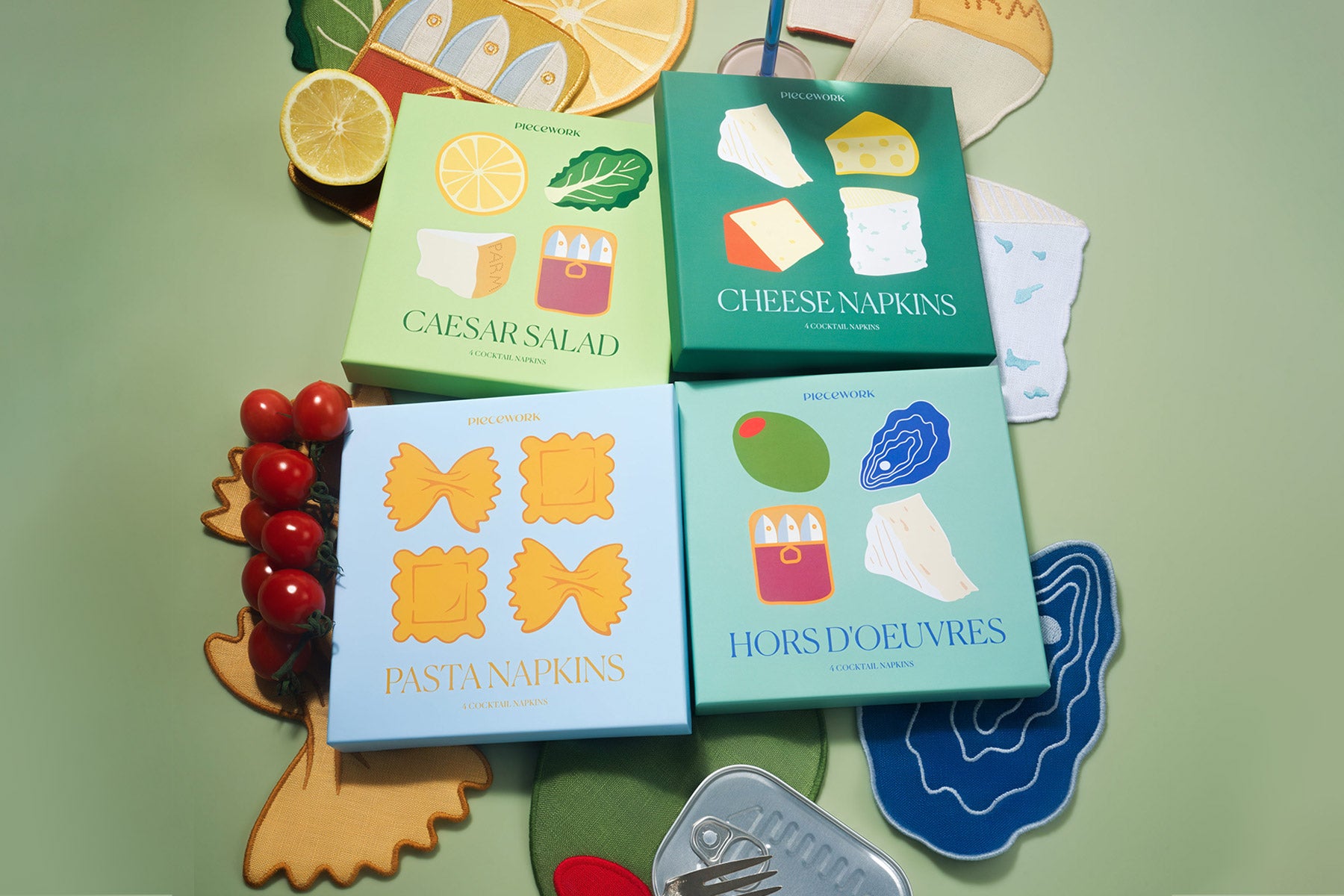 A group of savory cocktail napkin sets including Caesar Salad, Cheese, Pasta and Hors D'Oeuvres, alongside food props.