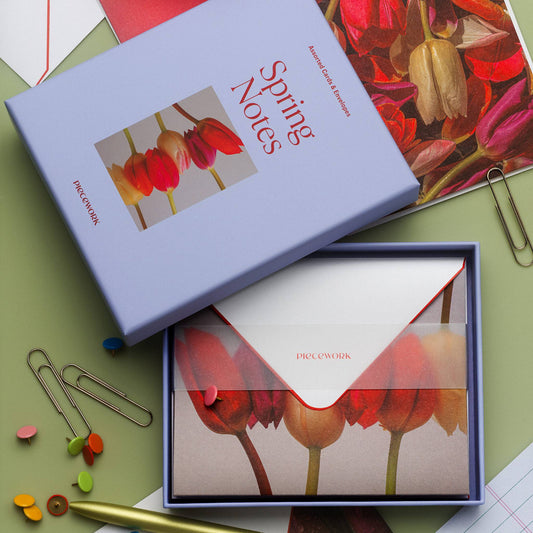 Piecework Spring Notes Stationery Set: periwinkle box and open tray of tulip notecards with paper clips on sage