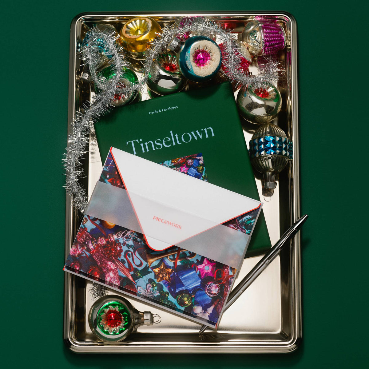 Piecework Tinseltown Stationery Set: deep green box and ornament notecards on a silver tray with vintage ornaments