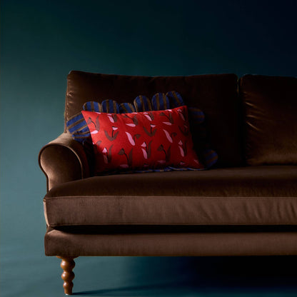 Tulip Stripe Petal Pillow on a brown velvet sofa