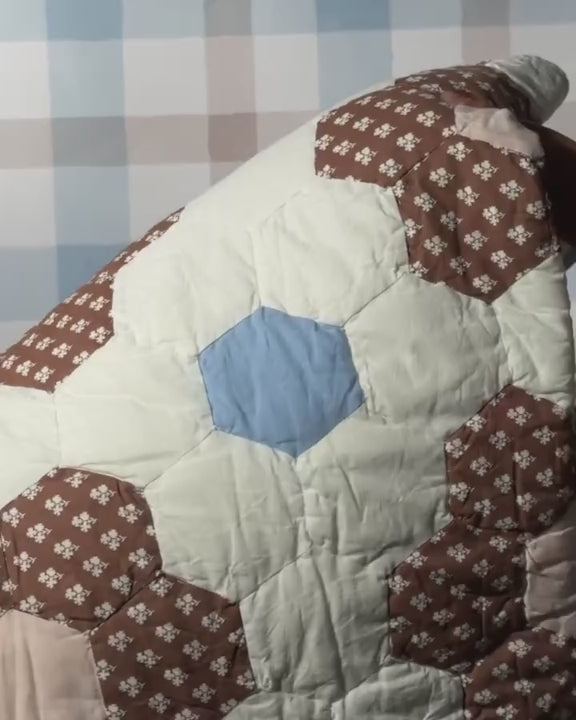 video showing constance quilted throw being unfolded and refolded.