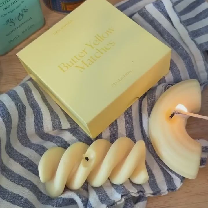 Video shows pasta candles being lit with a Piecework butter yellow match. 