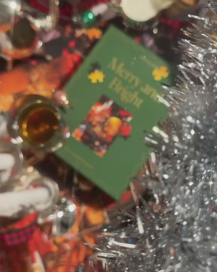 Video of behind-the-scenes from photo shoots of Piecework Puzzles' 1000-piece puzzle Merry and Bright. The scene is filled with flickering candlesticks, tinsel and tartan.